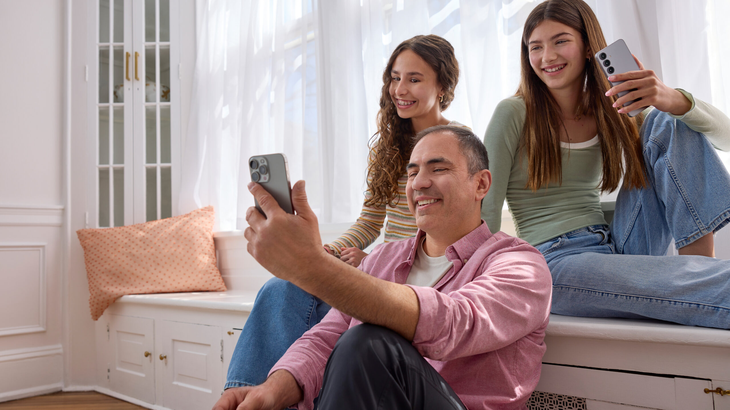 Family streaming content on their phones.
