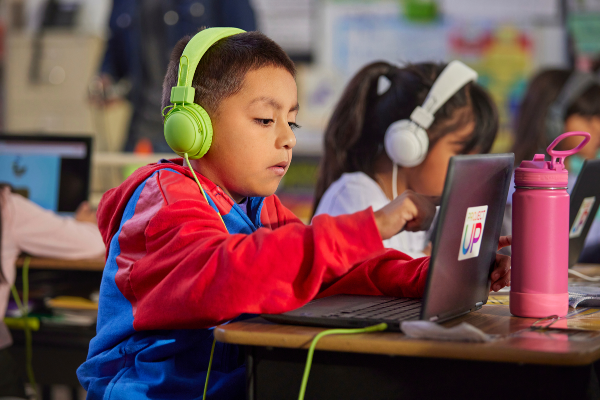 Students using laptops for school